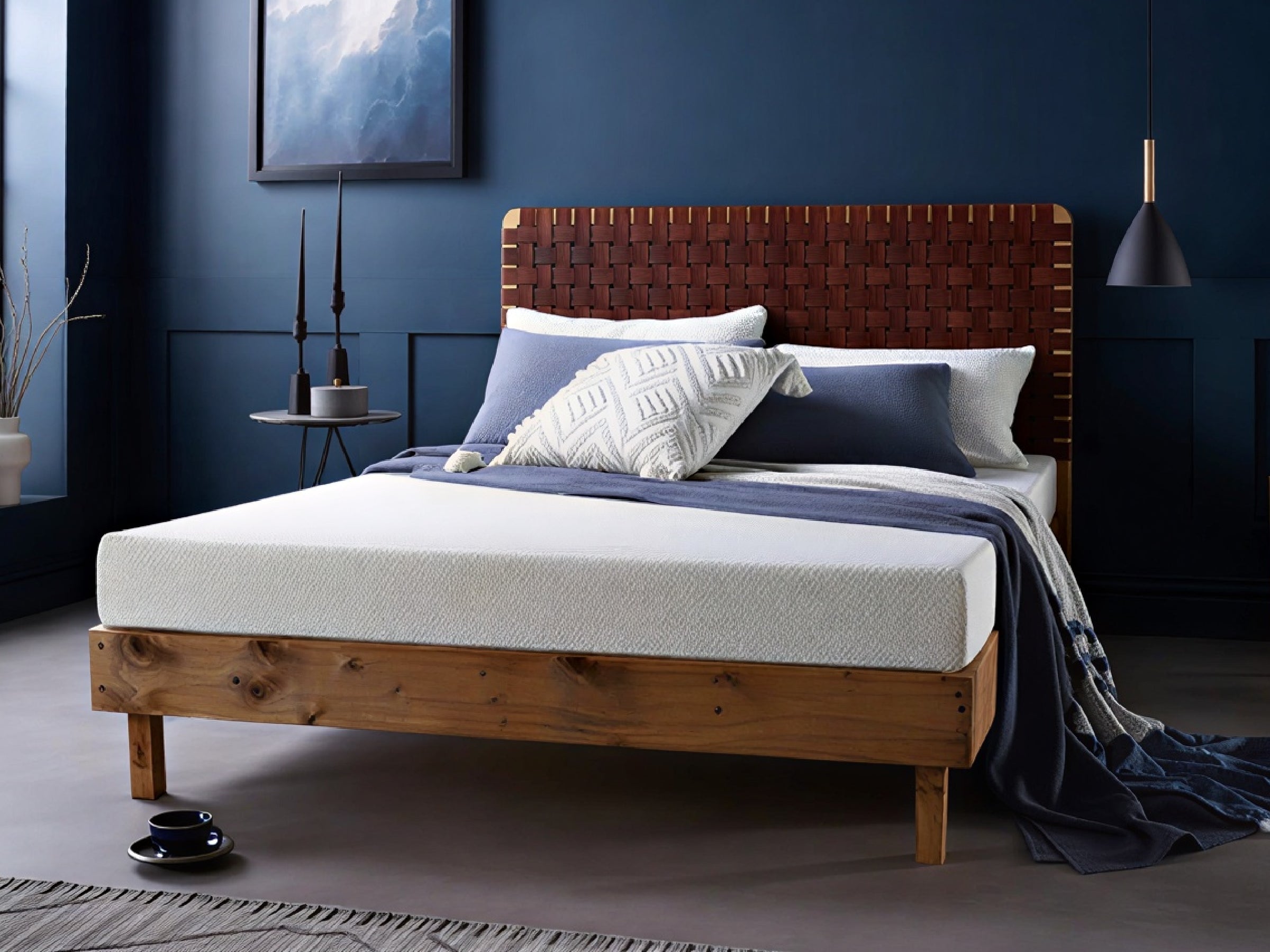 A Coolmax Classic Memory Foam Mattress on a bed frame, with a cooling mattress cover, in a bedroom setting.